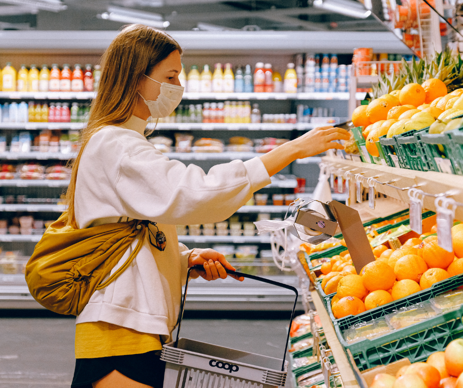 Woman grocery shopping during inflation, price increases, supply chain shortages, labor shortages